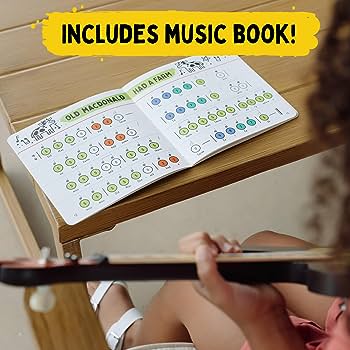 Guitarra y calculadora en una mesa